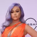 Latto shuts down a troll over her baby’s flight